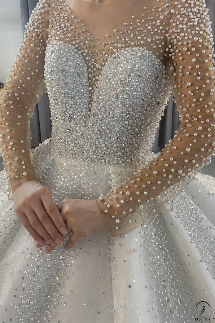 OSTTY - Luxury White Wedding Dress Long Sleeve V Neck Ball Gown Crystal Dresses OS4017 $1,299.99 OSTTY - Luxury White Wedding Dress Long Sleeve V Neck Ball Gown Crystal Dresses OS4017 $1,299.99